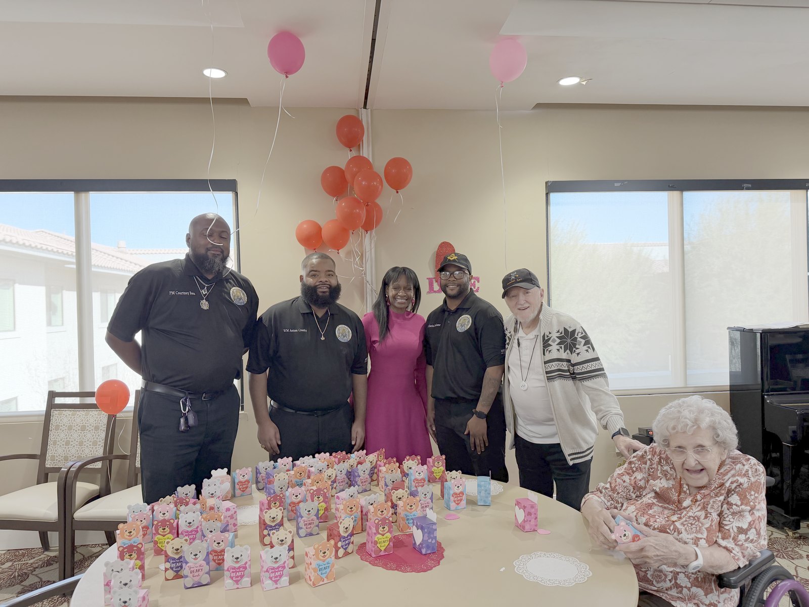 Directors and volunteers with residents at a Valentine's Day outreach